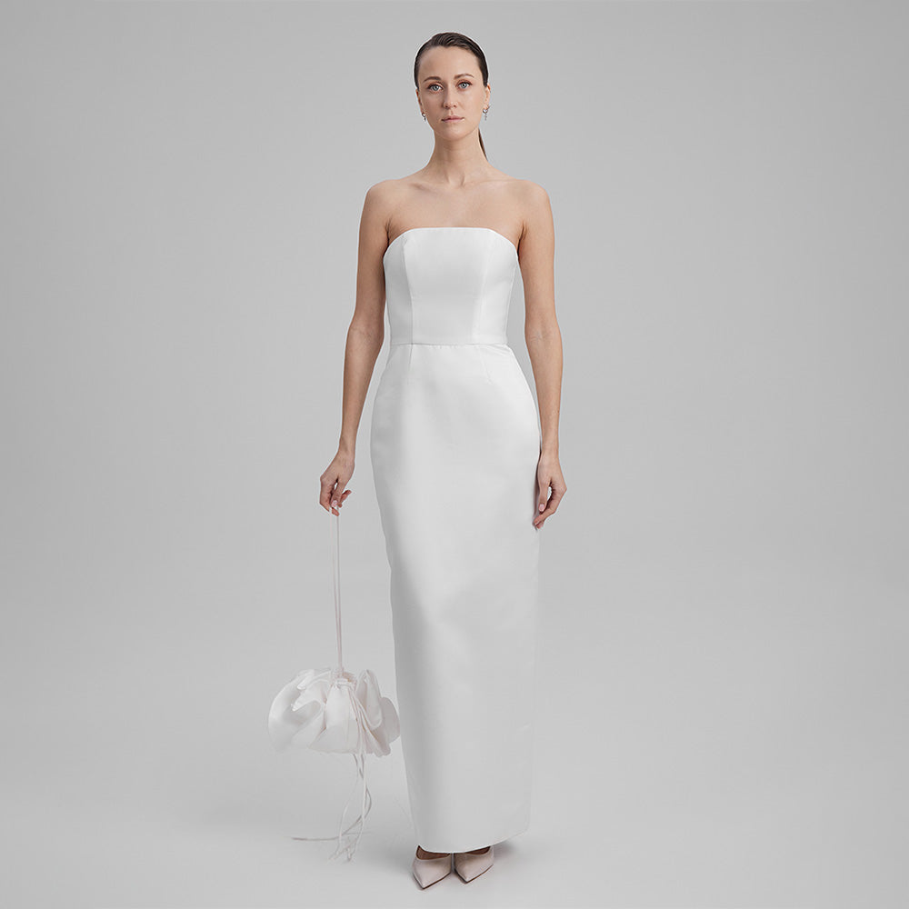 White strapless dress that showcases a refined simplicity that accentuates your natural grace. Explore our curation of designer dresses. Shop now!