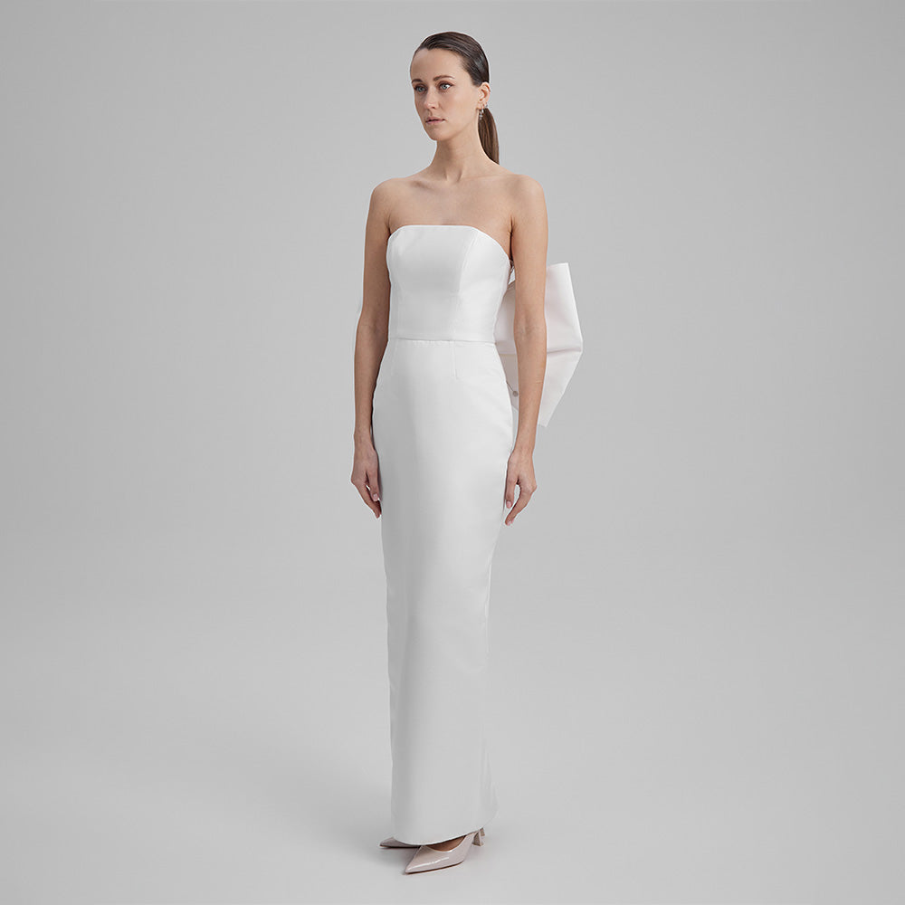 White strapless dress that showcases a refined simplicity that accentuates your natural grace. Explore our curation of designer dresses. Shop now!