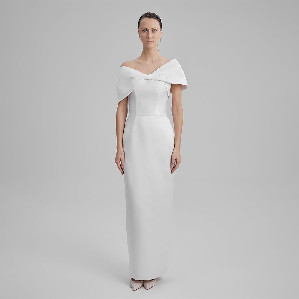 Explore our curation of timeless evening gowns with white strapless dress with a white shoulder bow that showcases an elegant silhouette. Shop now!