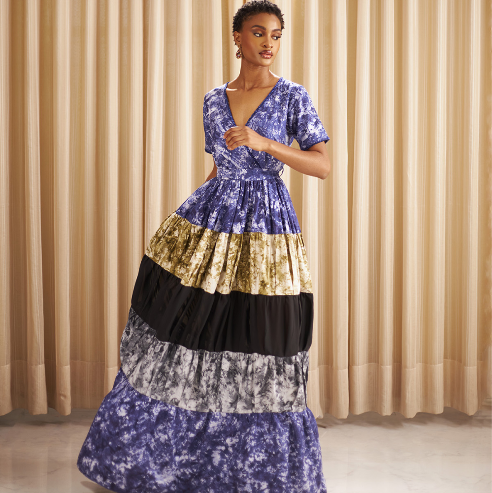 Crafted from hand dyed batik,this Kwelaku exclusive Ginika dress features a full, tiered flowy contrast hem.