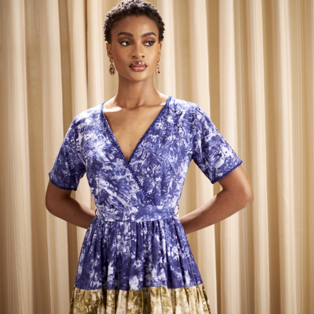 Crafted from hand dyed batik,this Kwelaku exclusive Ginika dress features a full, tiered flowy contrast hem.