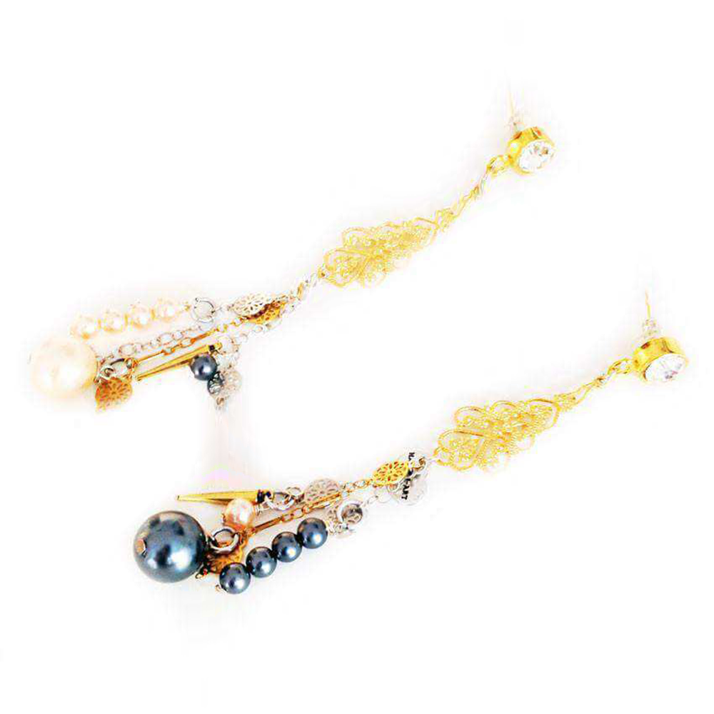 These handmade earrings with swarovski crystals, pearls, silver and gold charms.