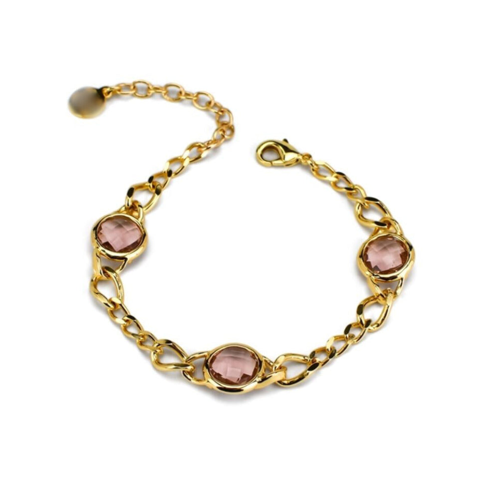 Elegant yellow gold plated bracelet with triple smoky grey crystals on a chic curb chain design. Perfect for luxe everyday styling. Shop premium jewelry online.