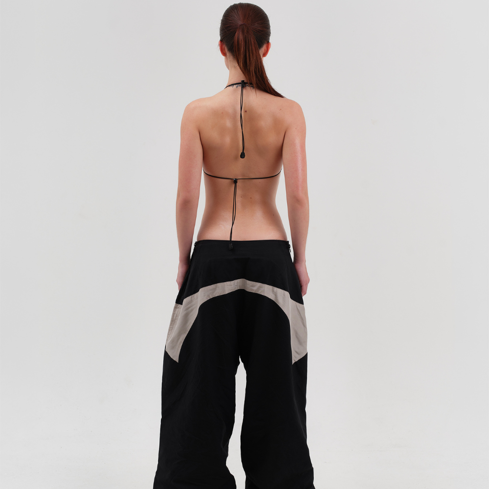 Shop online from our exclusive website and discover the Gorpcore Bikini Top by Voitech®, crafted from quick-dry technical fabric with adjustable bungee detailing and industrial-inspired hardware.