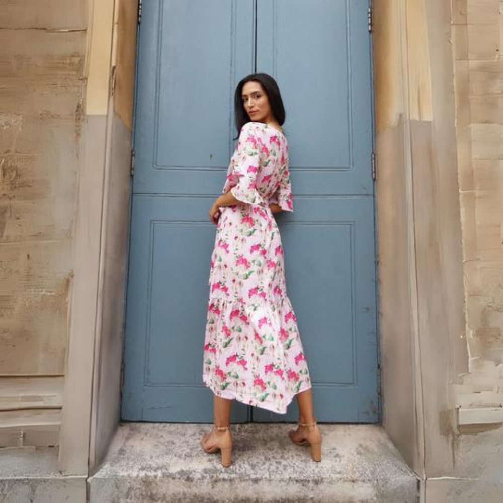 This beautiful pink floral midi dress features a detachable tie belt around the waist and mid length sleeves. 