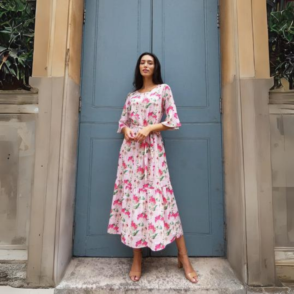 This beautiful pink floral midi dress features a detachable tie belt around the waist and mid length sleeves. 