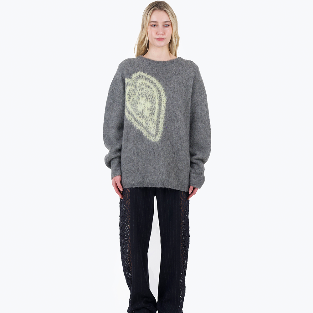 An oversized, warm and cosy mohair knit with a woven graphic heart design inspired by a vintage crochet doily.