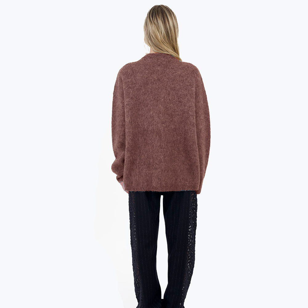 An oversized, warm and cosy mohair knit with a woven graphic heart design inspired by a vintage crochet doily.