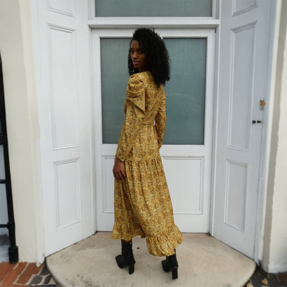Stunning golden print dress, with pleating at the top of the sleeve creating an elegant silhouette.