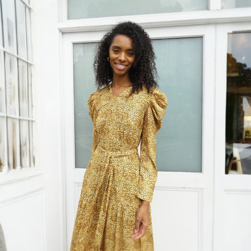 Stunning golden print dress, with pleating at the top of the sleeve creating an elegant silhouette.