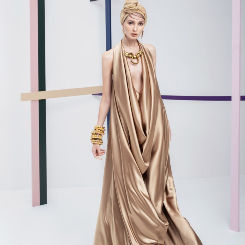 A unique Ready to wear dress. This Halter neck, floor length, golden color gown is perfect for any party occasion.