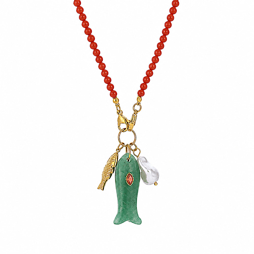 Discover the Happy Fish Carnelian & Aventurine Necklace at The Luxe Maison, featuring vibrant carnelian beads and a hand-carved aventurine fish.