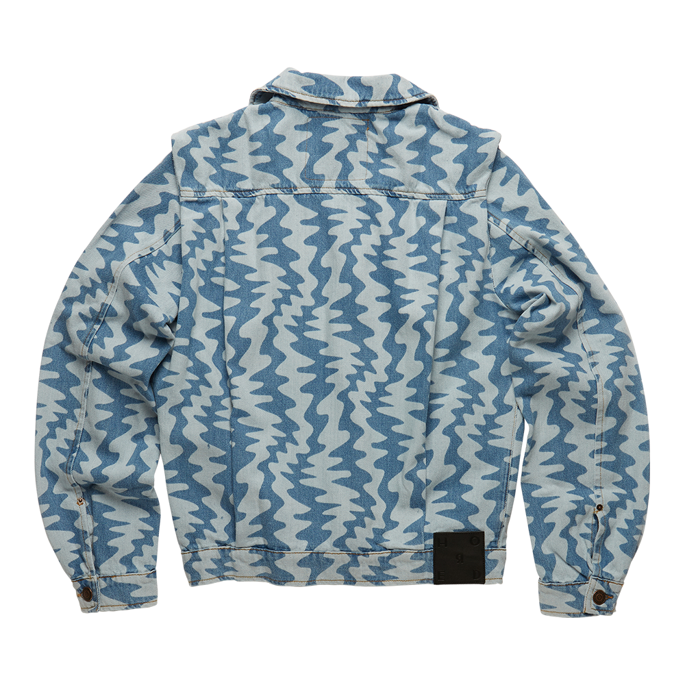 Horde Studio white denim jacket is patterned with cerulean blue wavy motif. It’s crafted from a rigid denim 