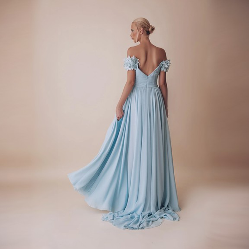 Off shoulder, falling sleeves with fitted bodice and heavy flared lower bodice. 