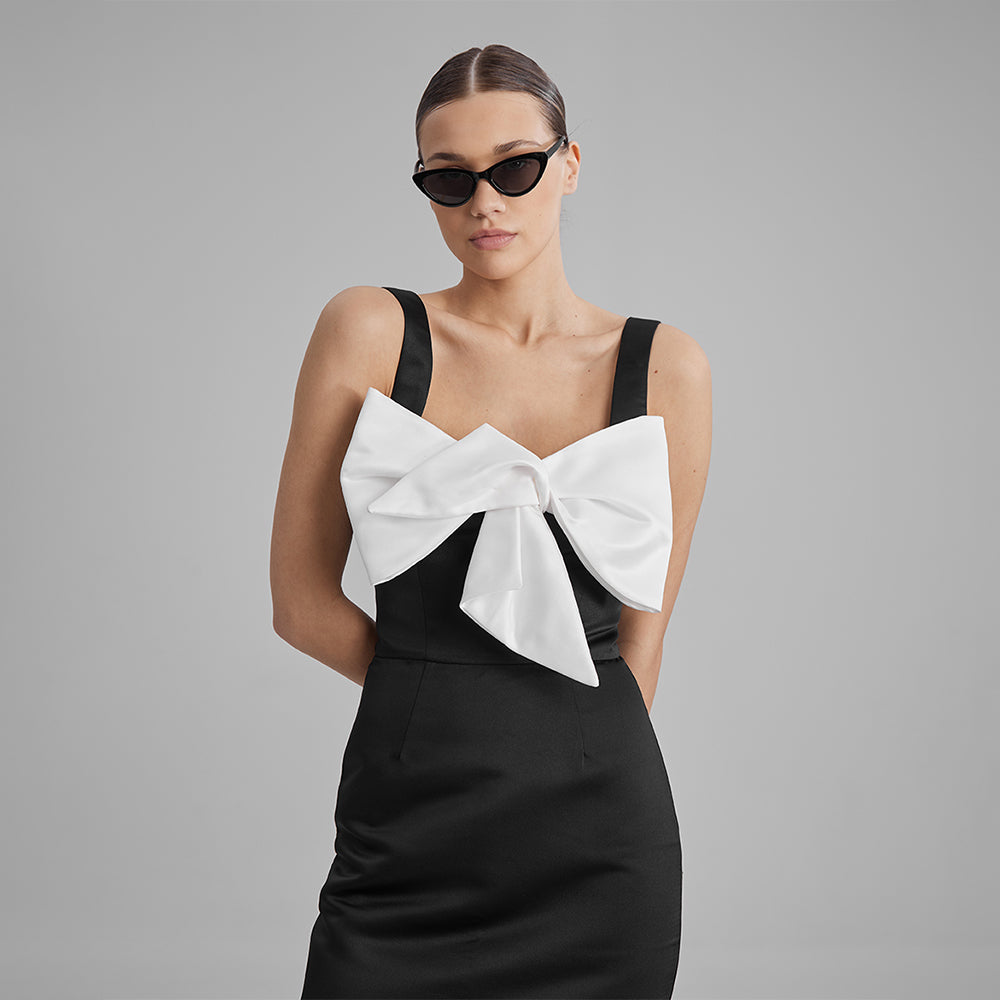 Explore women's evening dresses with our black column silhouette dress with a square neckline & small white bow to elevate your style. Shop now!