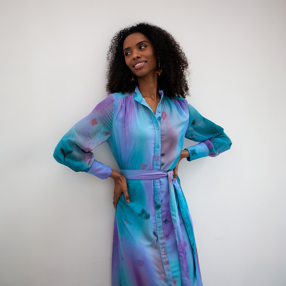 The Immi dress is a stunning maxi-length dress with gorgeous hues of blue and purple. 