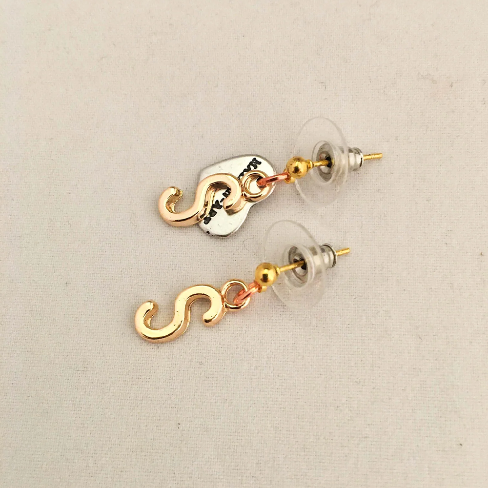 18Kt Gold Plated Letters and chain, Rose Gold Plated brass charms. Nickel-free pendant and coating. 
