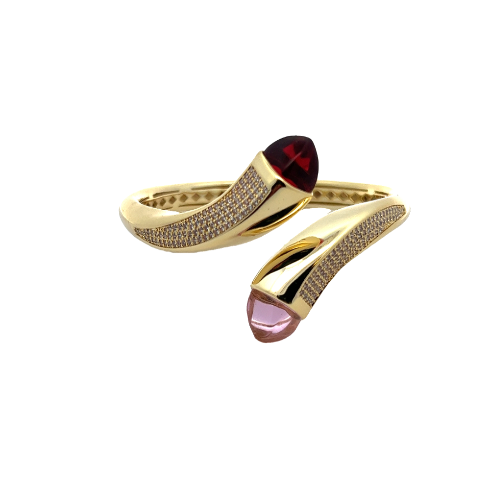 Elegant yellow gold plated wrap cuff bracelet with blue chalcedony crystals and pavé cubic zirconia accents. A luxe statement piece for every occasion. Shop premium jewelry online.