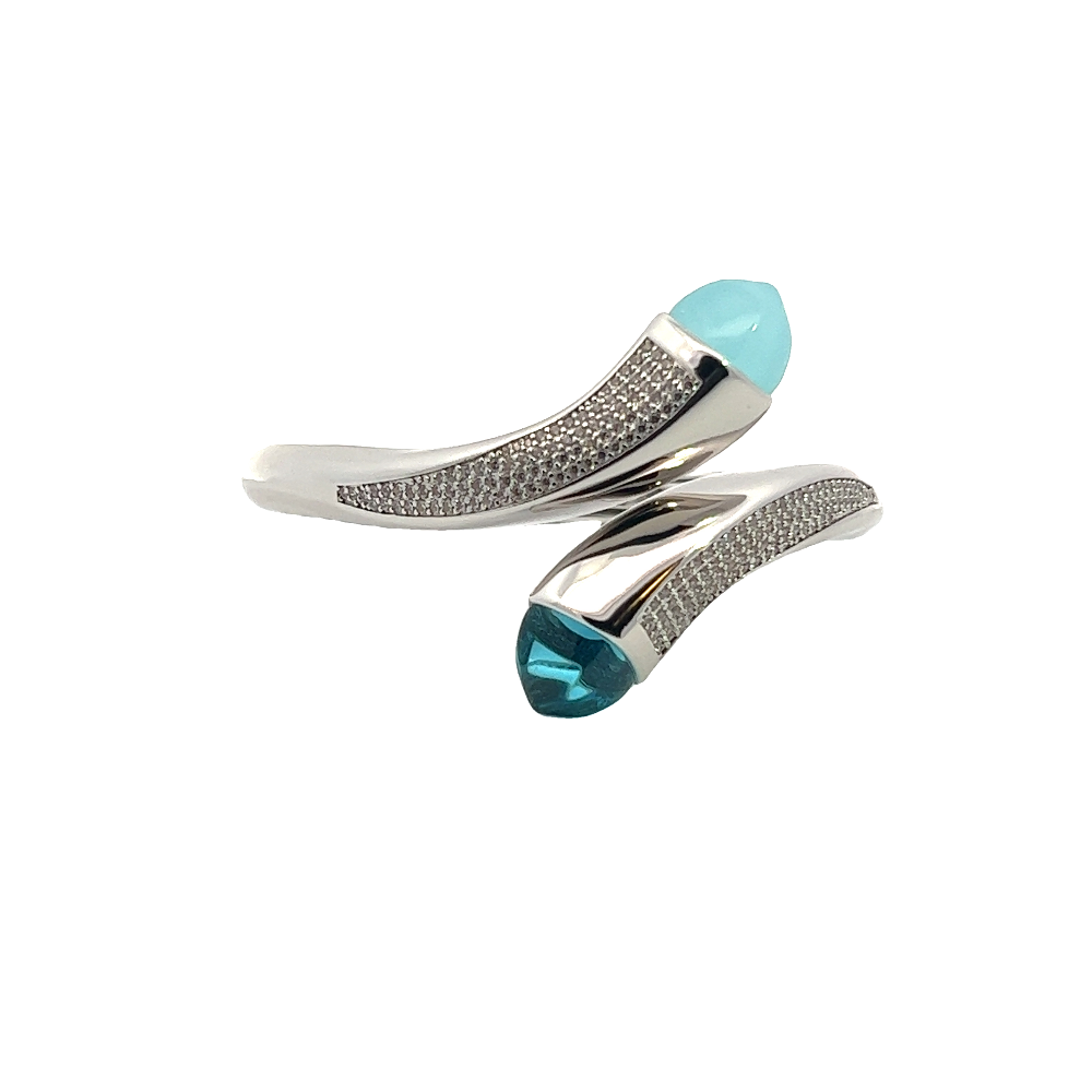 Elegant rhodium plated wrap cuff bracelet with blue chalcedony crystals and pavé cubic zirconia accents. A chic statement piece for every occasion. Shop premium jewelry online.