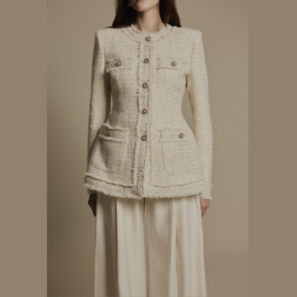 Create a polished look by styling a luxe dress with the elegant Ivory Crest Tweed Jacket. Shop Now!