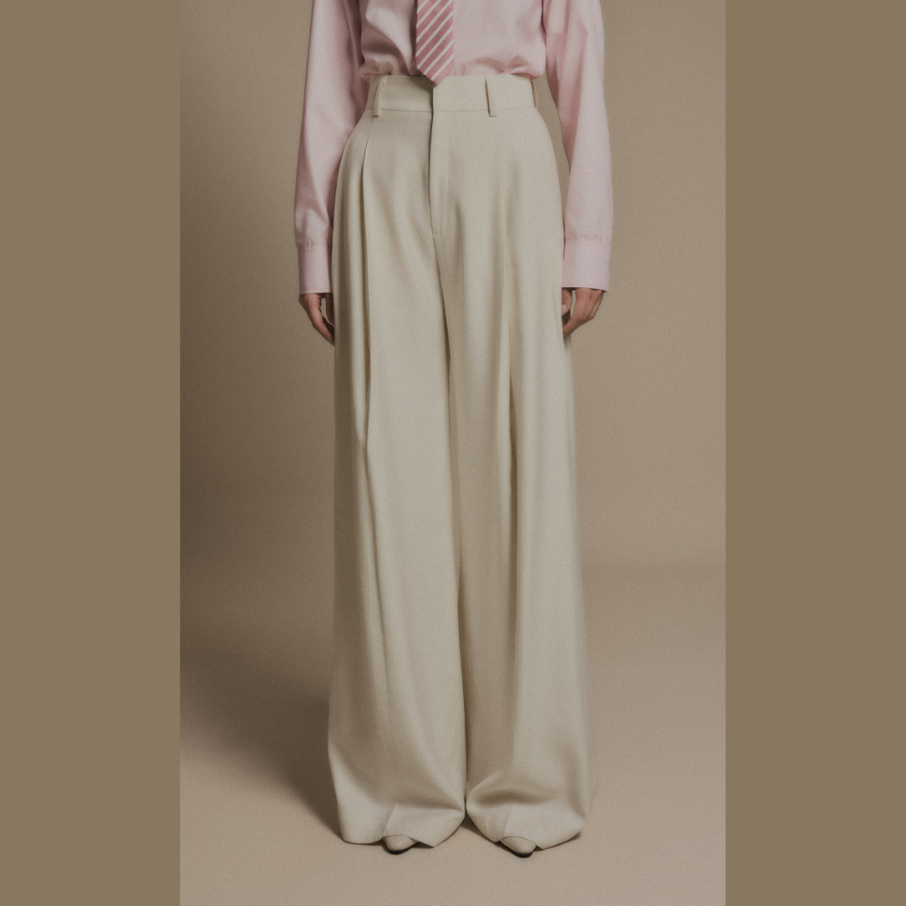 Experience modern luxury clothing paired seamlessly with sophisticated Ivory Drift Pants. Shop Now!