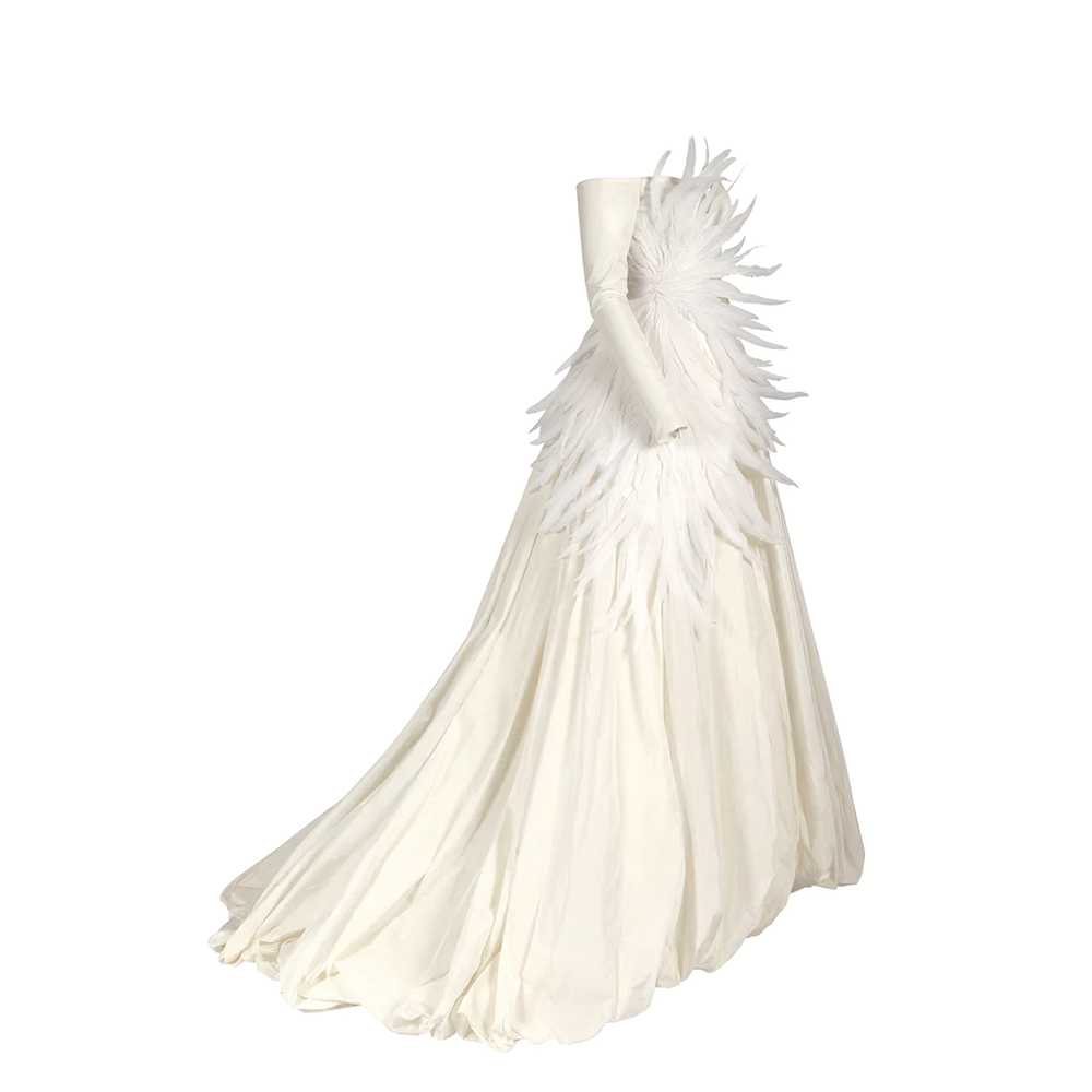 Off-the-shoulder ivory silk taffeta puffball wedding gown featuring plumes emerging at the side waist.