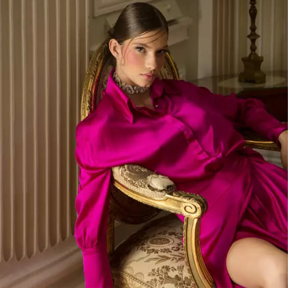 The finest silk in fuchsia Long sleeve maxi shirt-dress Side slit cut Front button fastening Wraparound style.