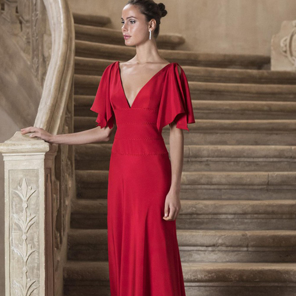 Sheath gown in silk cady with deep v neckline, open sleeves and hand beaded belt at the waist.