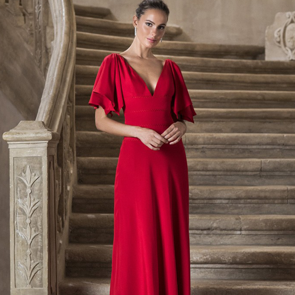 Sheath gown in silk cady with deep v neckline, open sleeves and hand beaded belt at the waist.