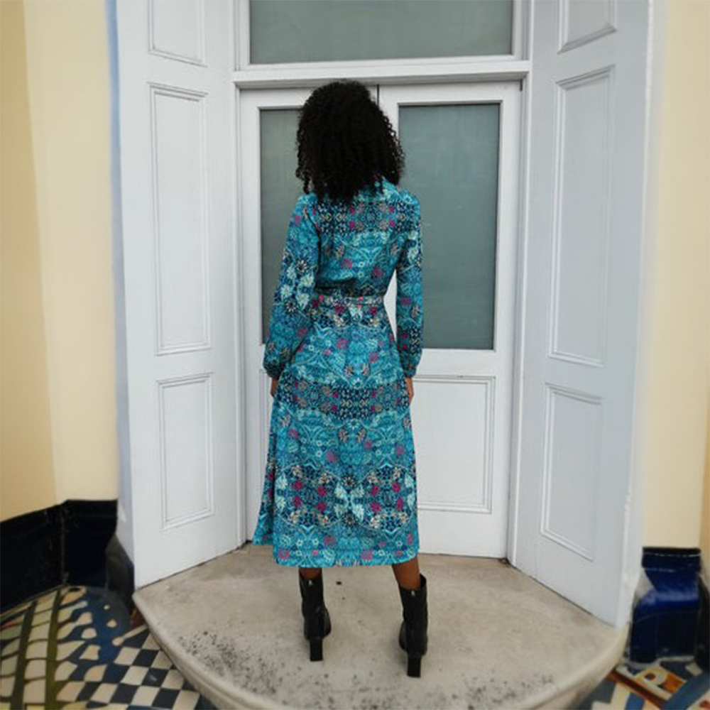 The Jolene Dress is a beautiful midi blue printed shirt dress with a front placket and cuff detail. 