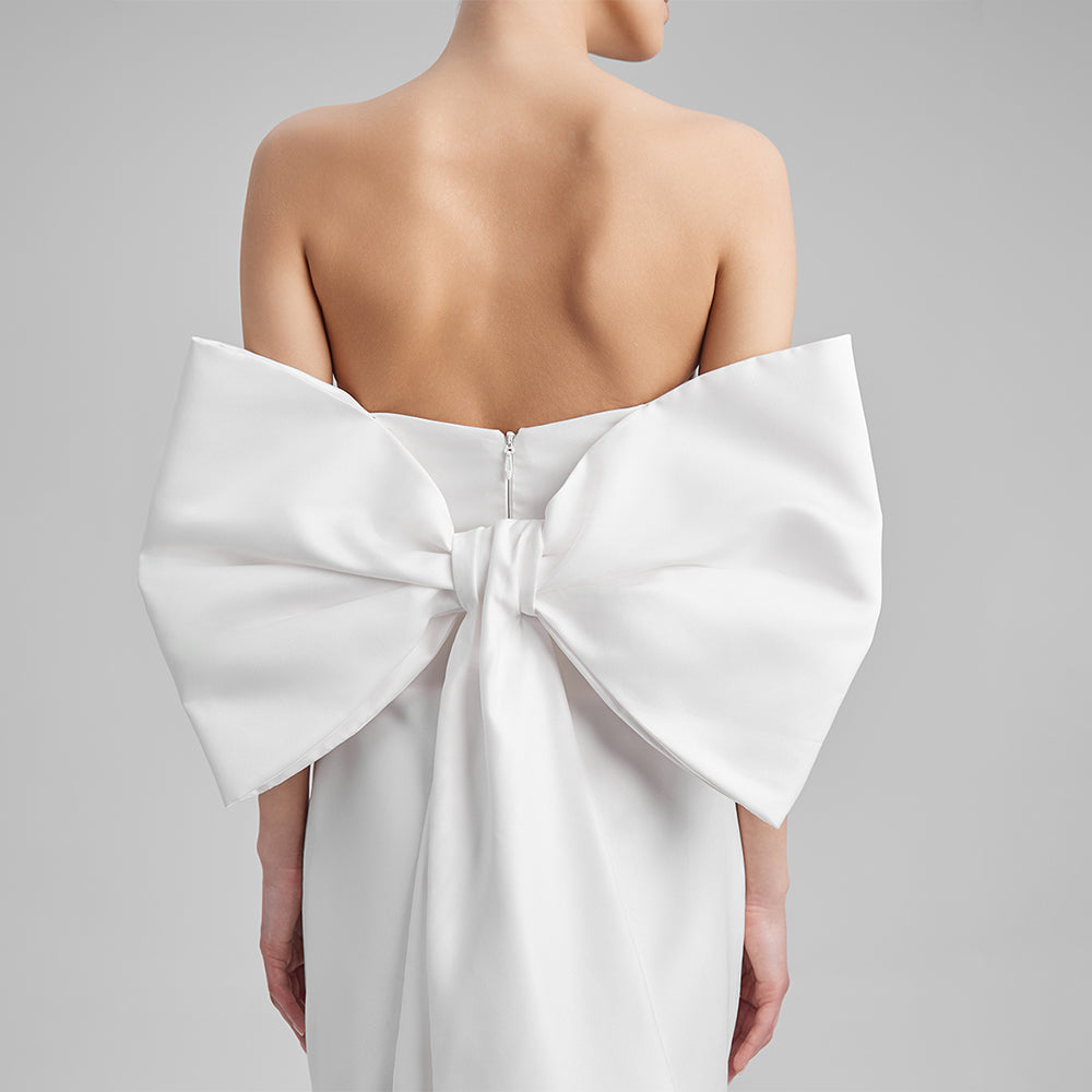 Shop our white mini dress crafted from Mikado with strapless corset and a removable bow. Explore our range of designer dresses for women. Shop now!