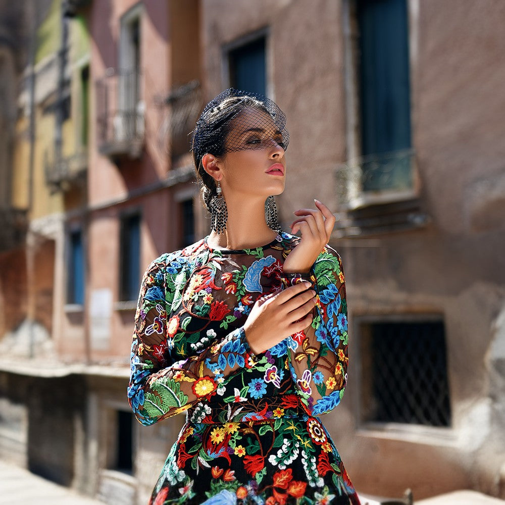 This unique, gorgeous floral evening midi dress offers a colorful, artsy alternative to your formalwear wardrobe.