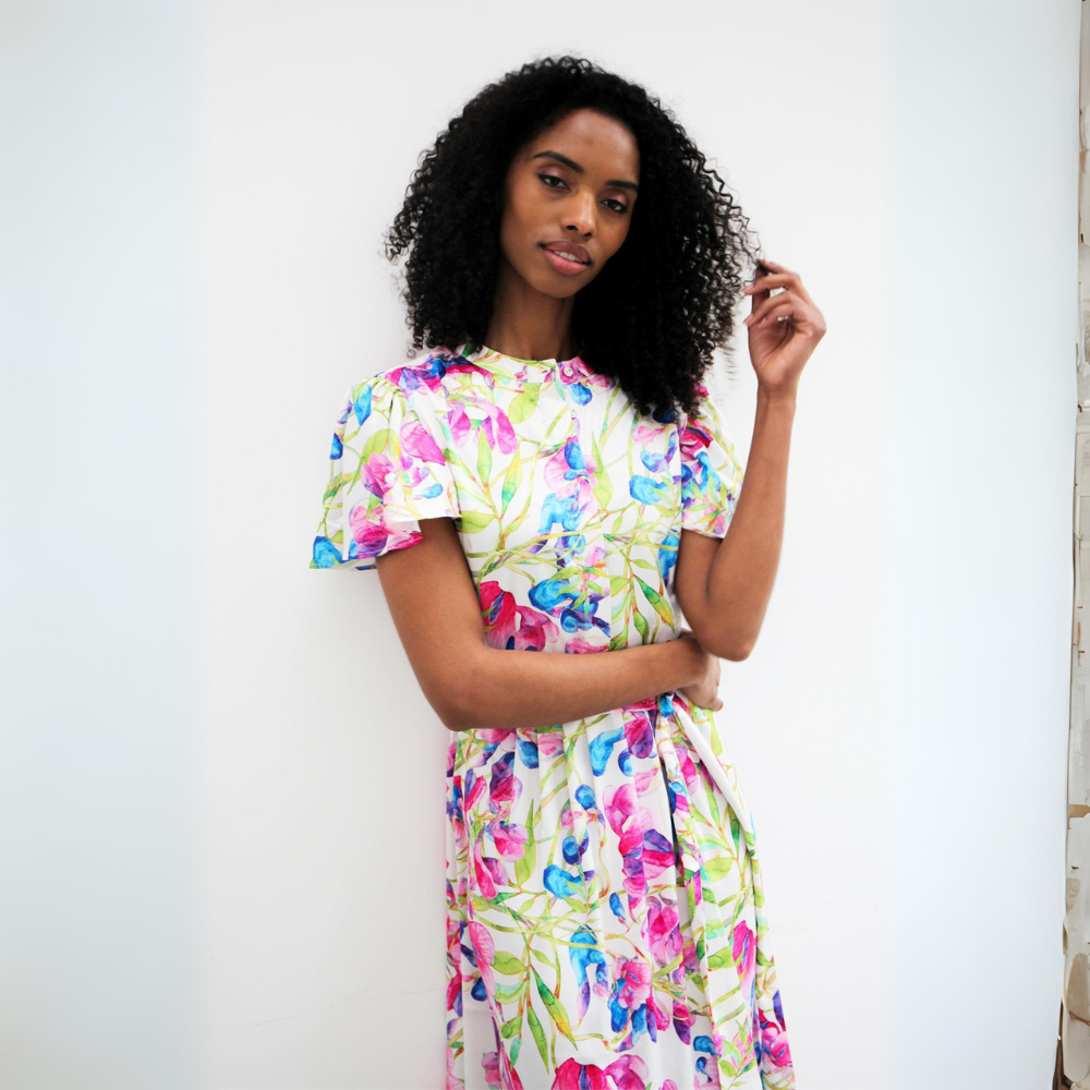 This midi-length dress features a gorgeous pink green and blue floral pattern. 