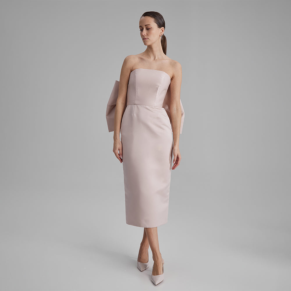 Shop our Kira fitted dress in stunning nude color with a strapless neckline & removable bow. Explore our range of classic designer dresses. Shop now!