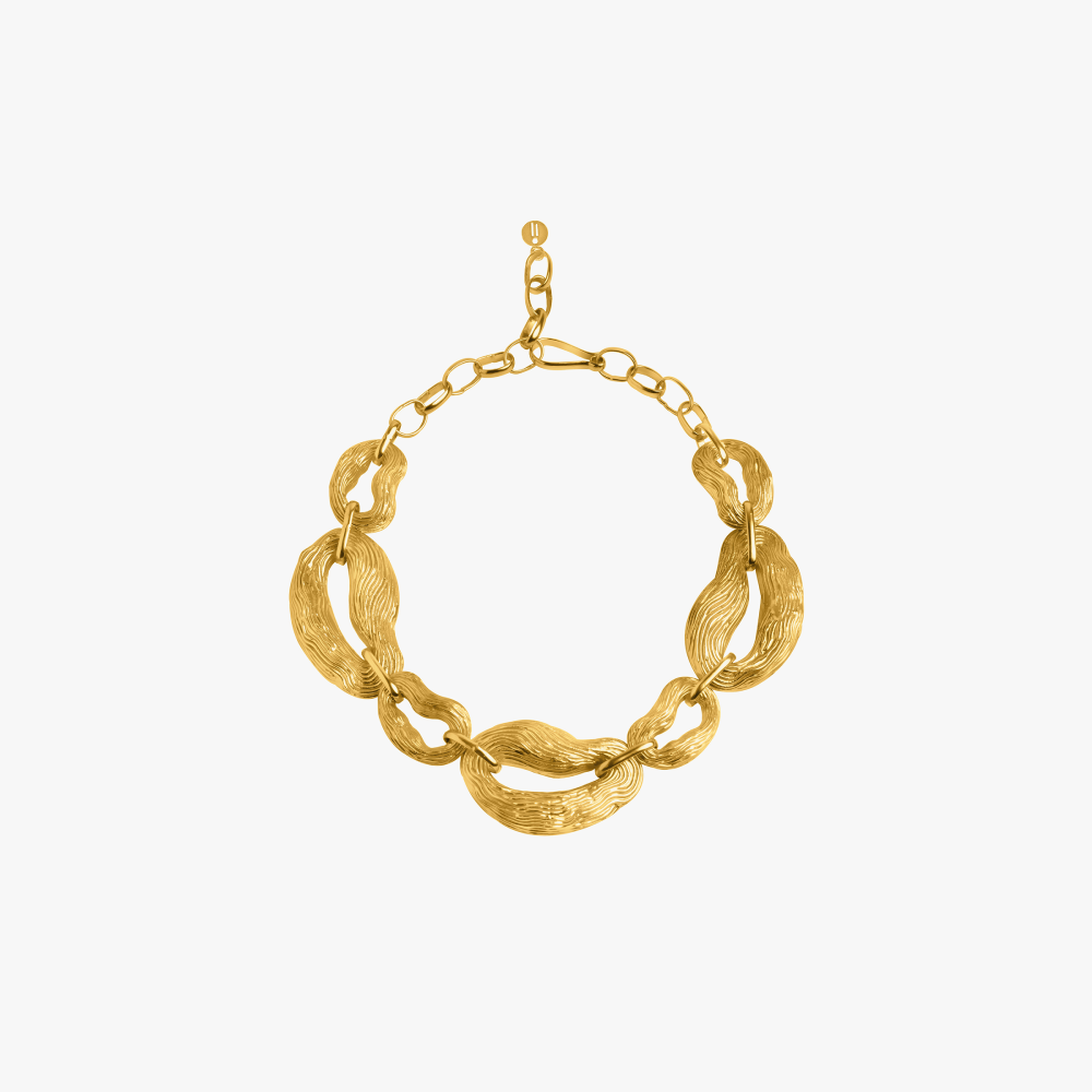 Inspired by the gnarly forms and texture found on the knotty pine trees, this maximal link necklace is a bold addition.
