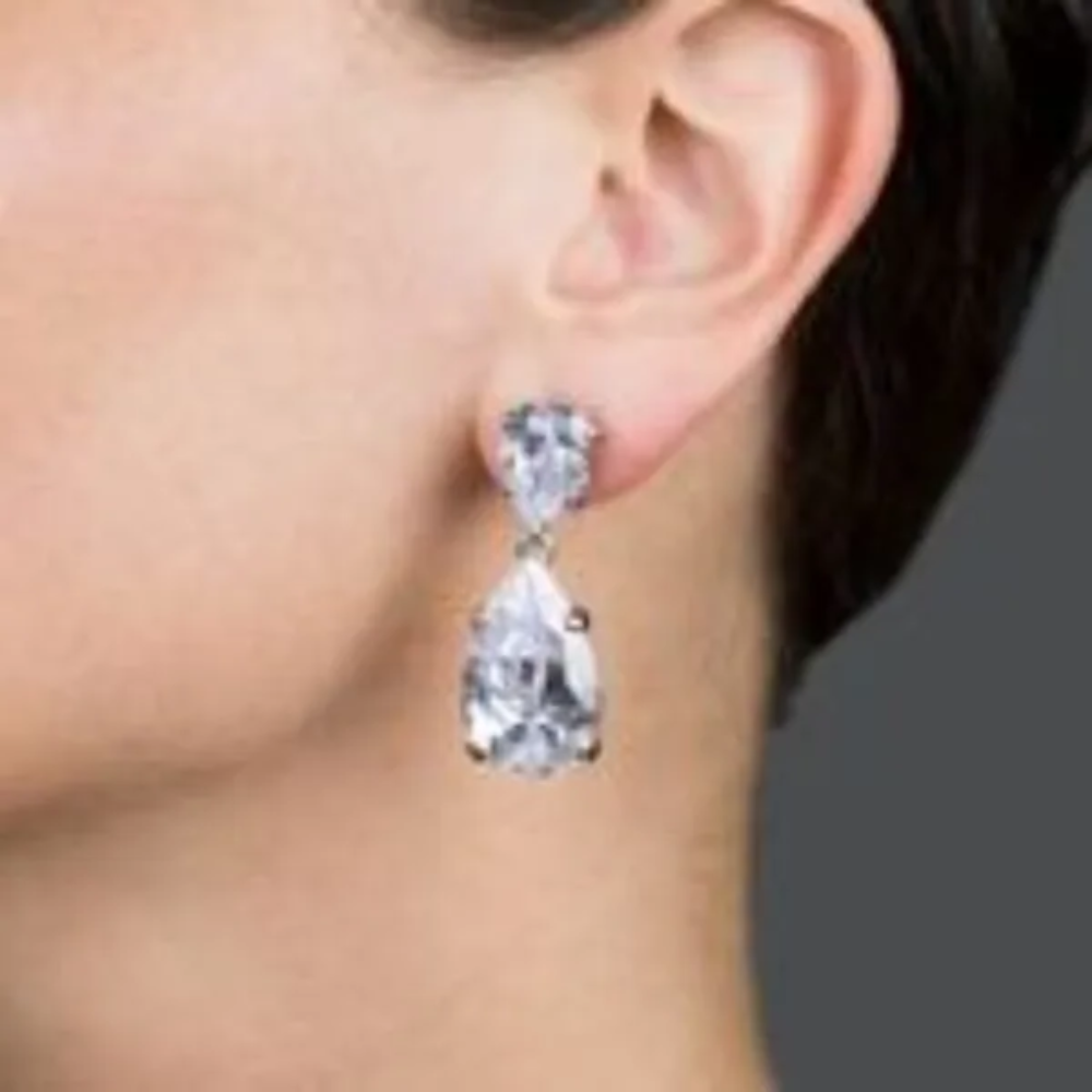 20CTTW double pear cubic zirconia drop earrings. Pierced ear set in rhodium-plated brass.