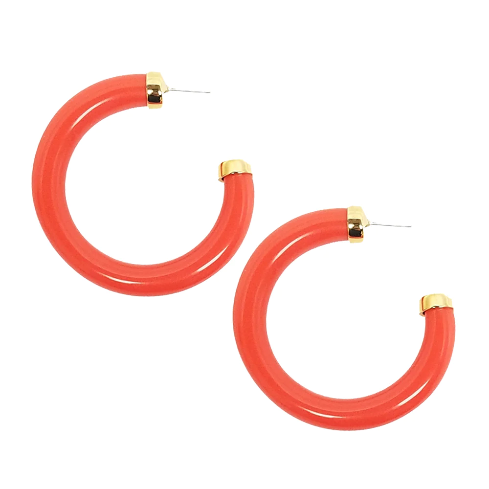 Complete your collection with these resin hoop earrings polished off with gold end caps. 