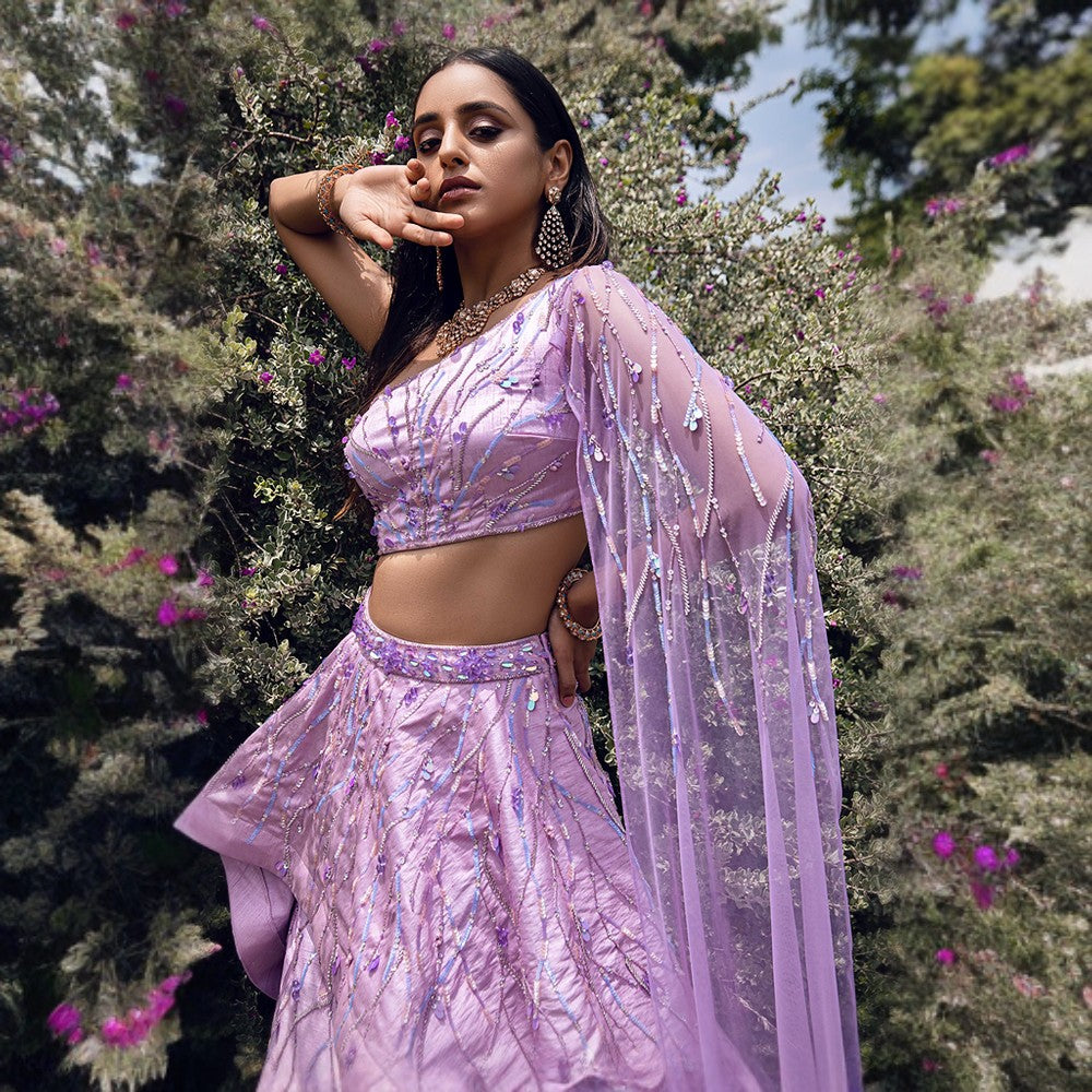 Dew drop embroidery all over the blouse, lehenga and duppatta.