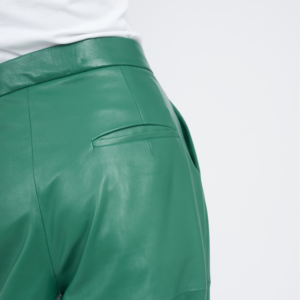 This unique cargo styles pants are  made from leather with a high-rise waist and slouchy, tapered legs.