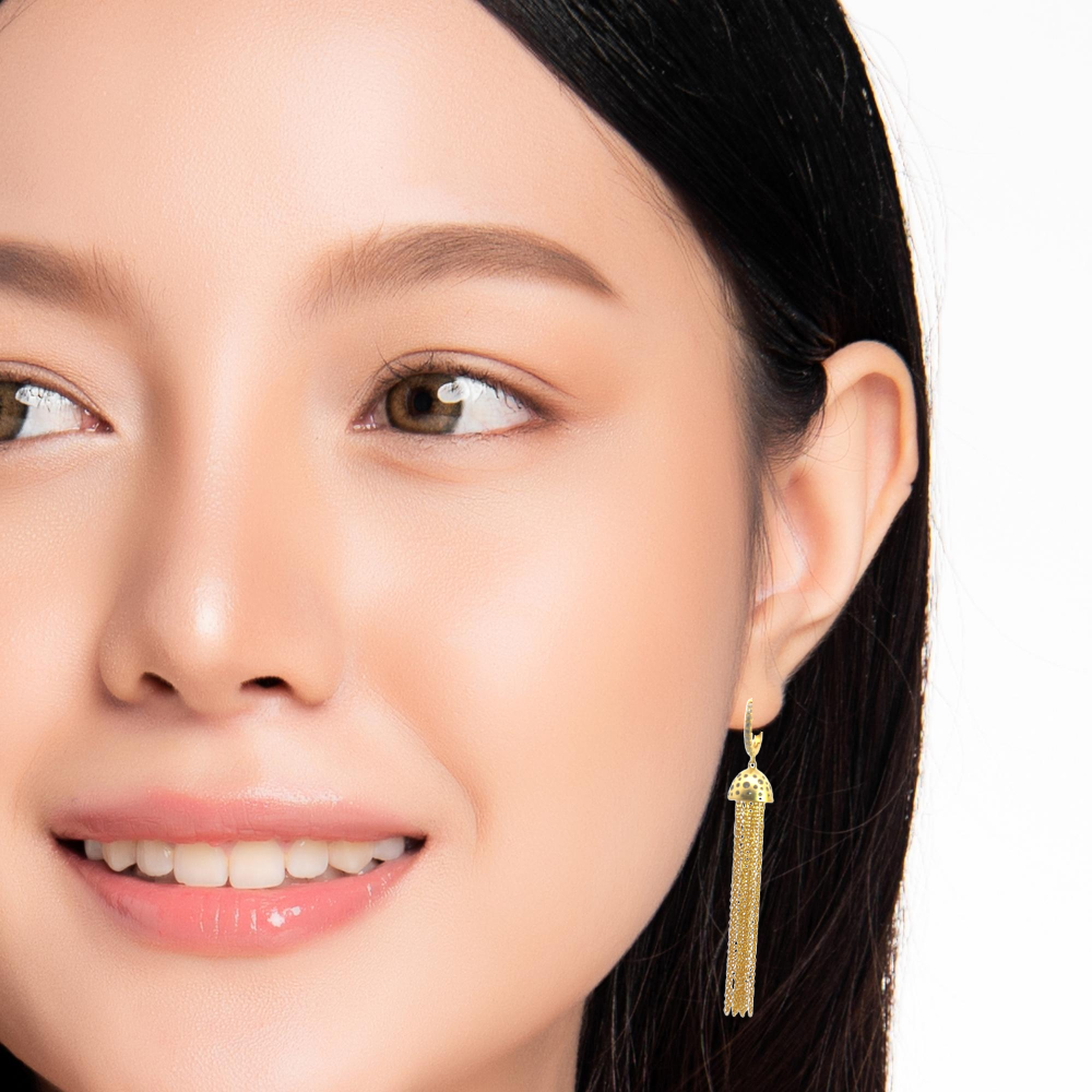 Shop online premium 18K gold shoulder duster earrings with sparkling cubic zirconia chains.
