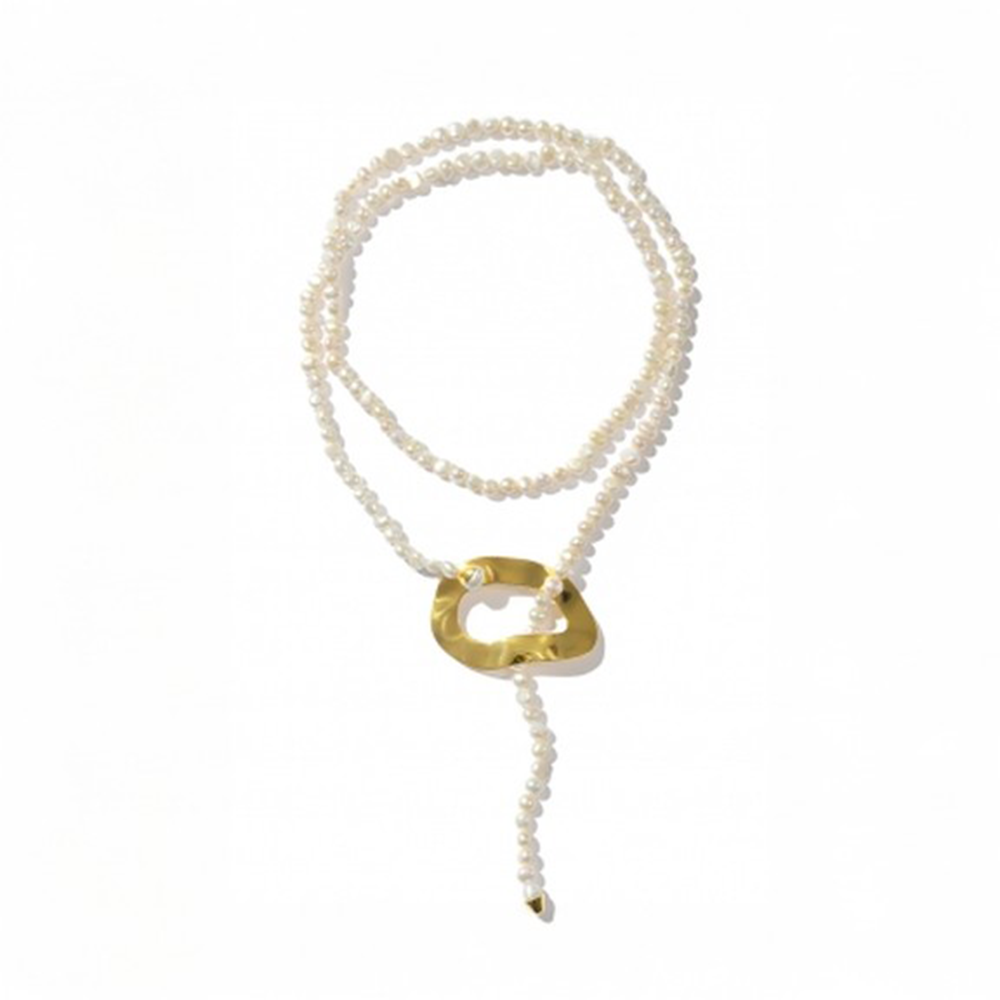 Long pearl necklace with oversized reflective surface detail.
