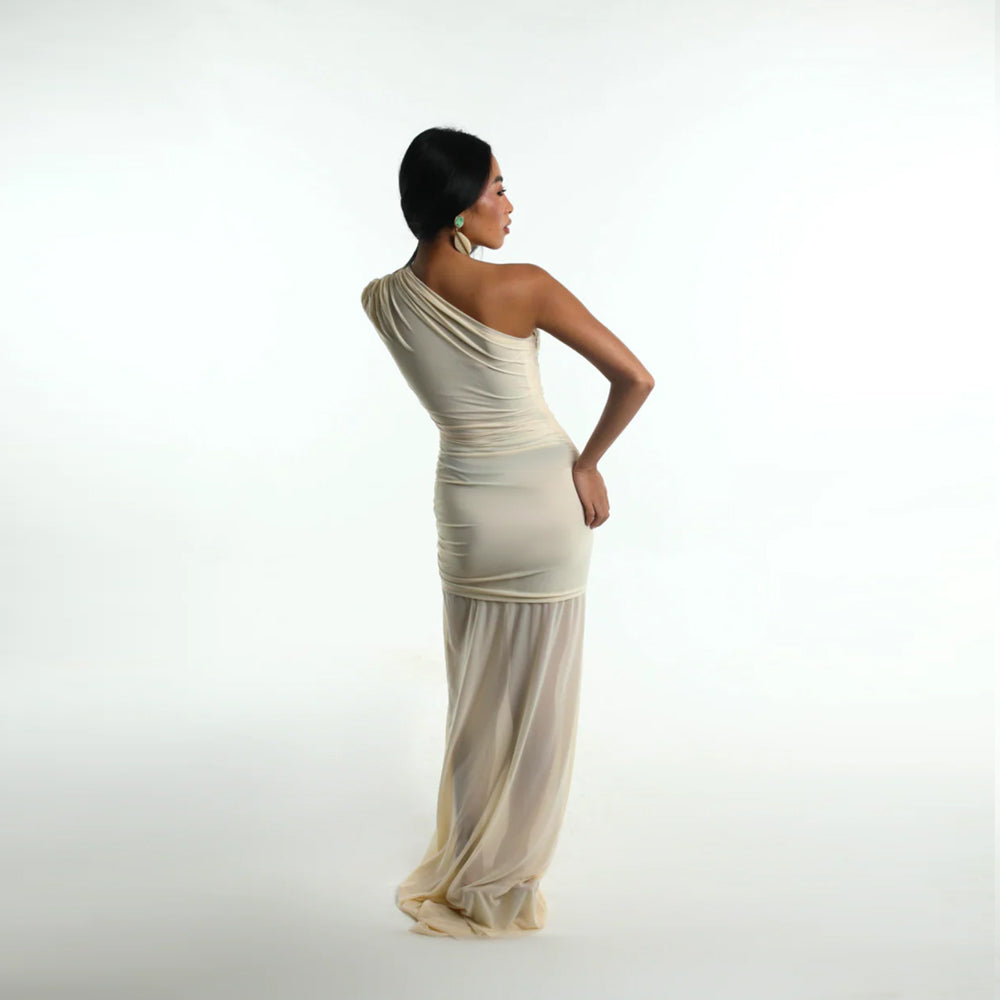 Ivory jersey dress with asymmetrical fit and gathered waist, perfect for events. Shop online from our curated edit of premium fashion.