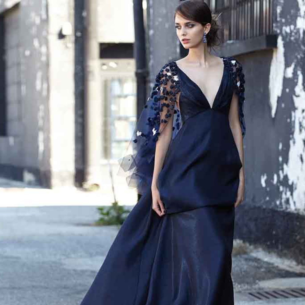 Organza slip dress with deep v-neckline and hand-embroidered cape with chiffon cubes and crystals. 