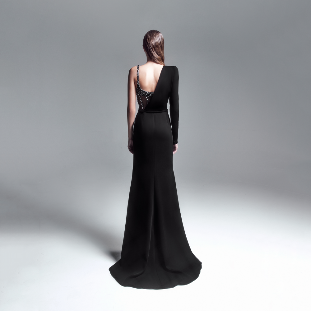 Long draped “Black “cady dress, a side slit skirt, featuring an asymmetrical embellished corset cut bodice.