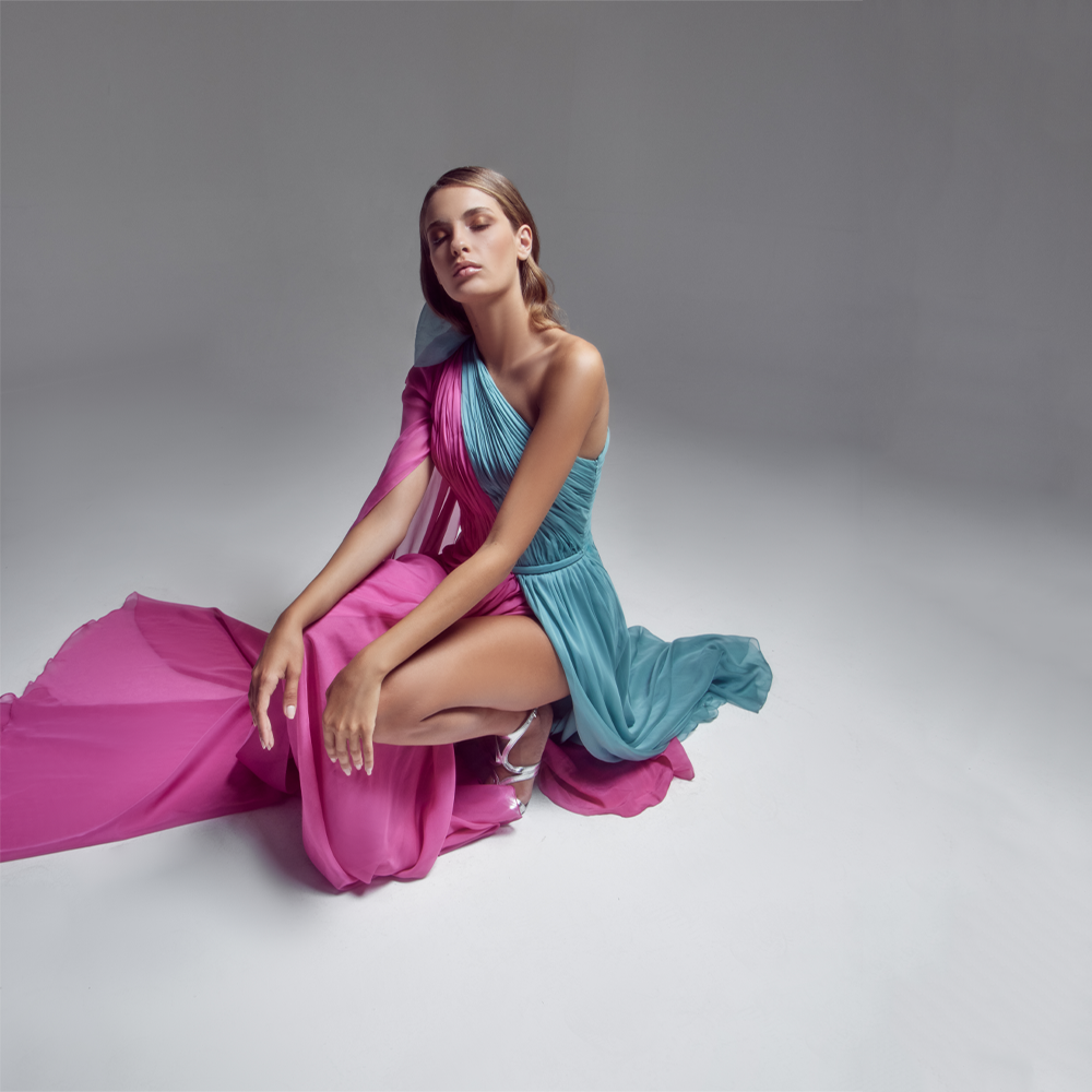 Long draped, Asymmetrical “Bubble Gum pink” and “Teal Green” chiffon dress, a slit skirt and a cape.