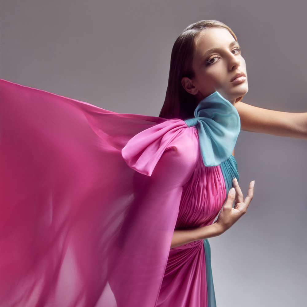 Long draped, Asymmetrical “Bubble Gum pink” and “Teal Green” chiffon dress, a slit skirt and a cape.