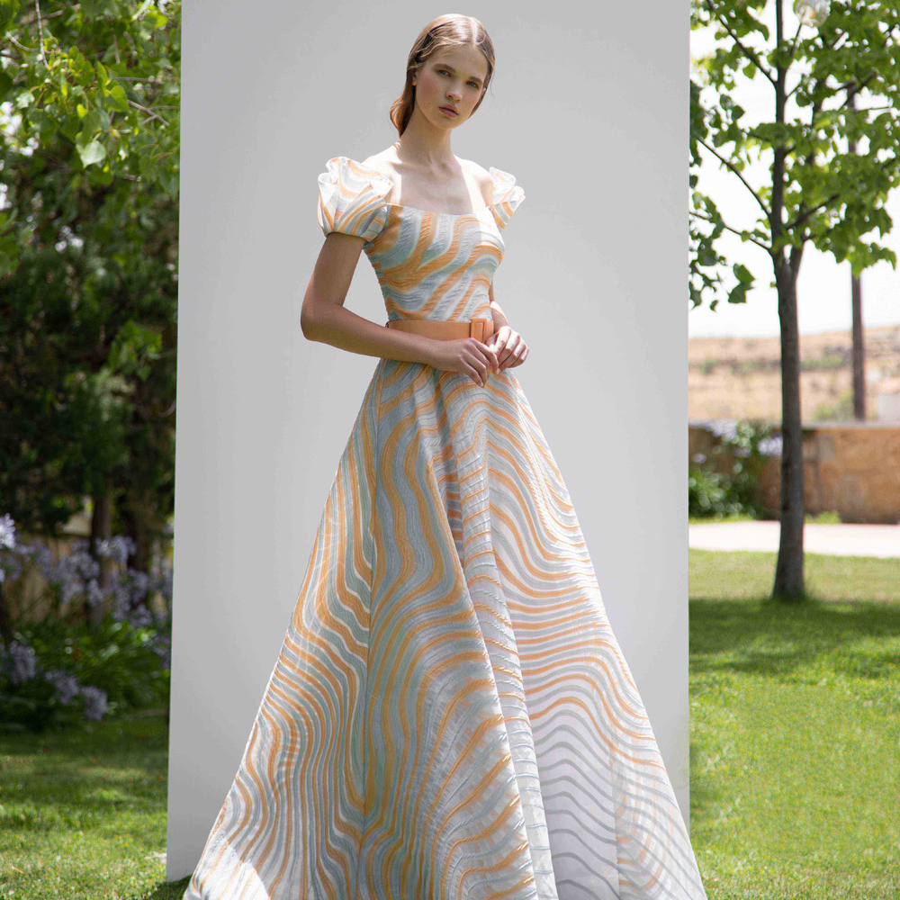 Off shoulder full skirt silk jaccard organza gown with reversed charming sleeves.