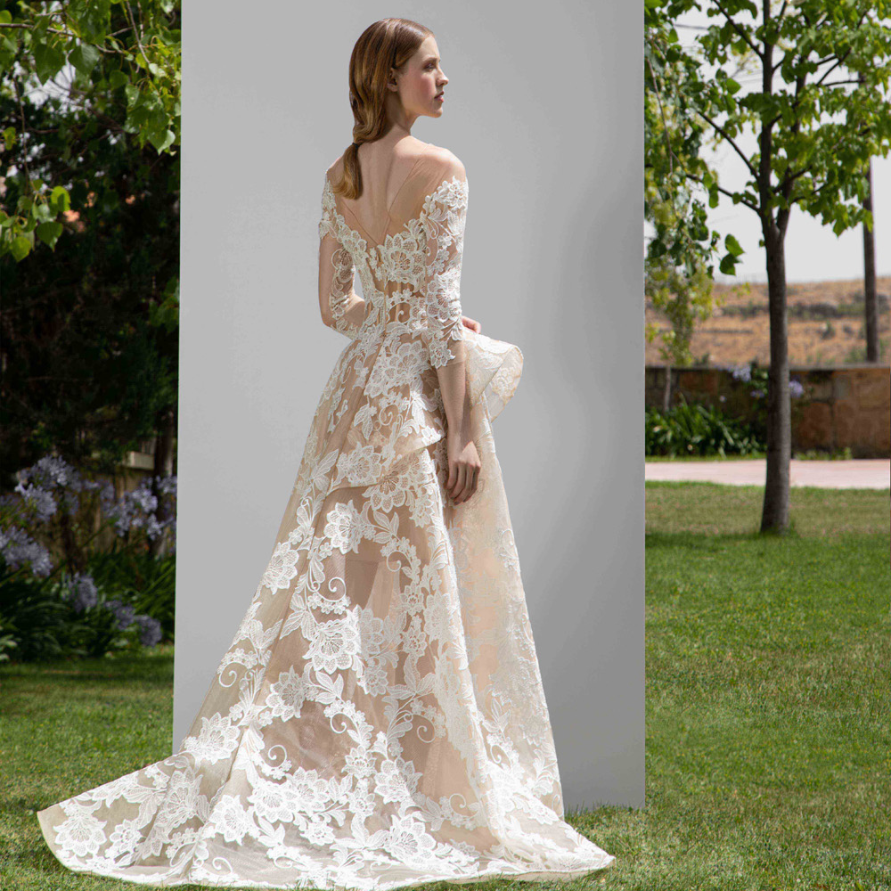 Full floral lace gown with a side ruffle, 4/3 sleeves and a scoop collar.