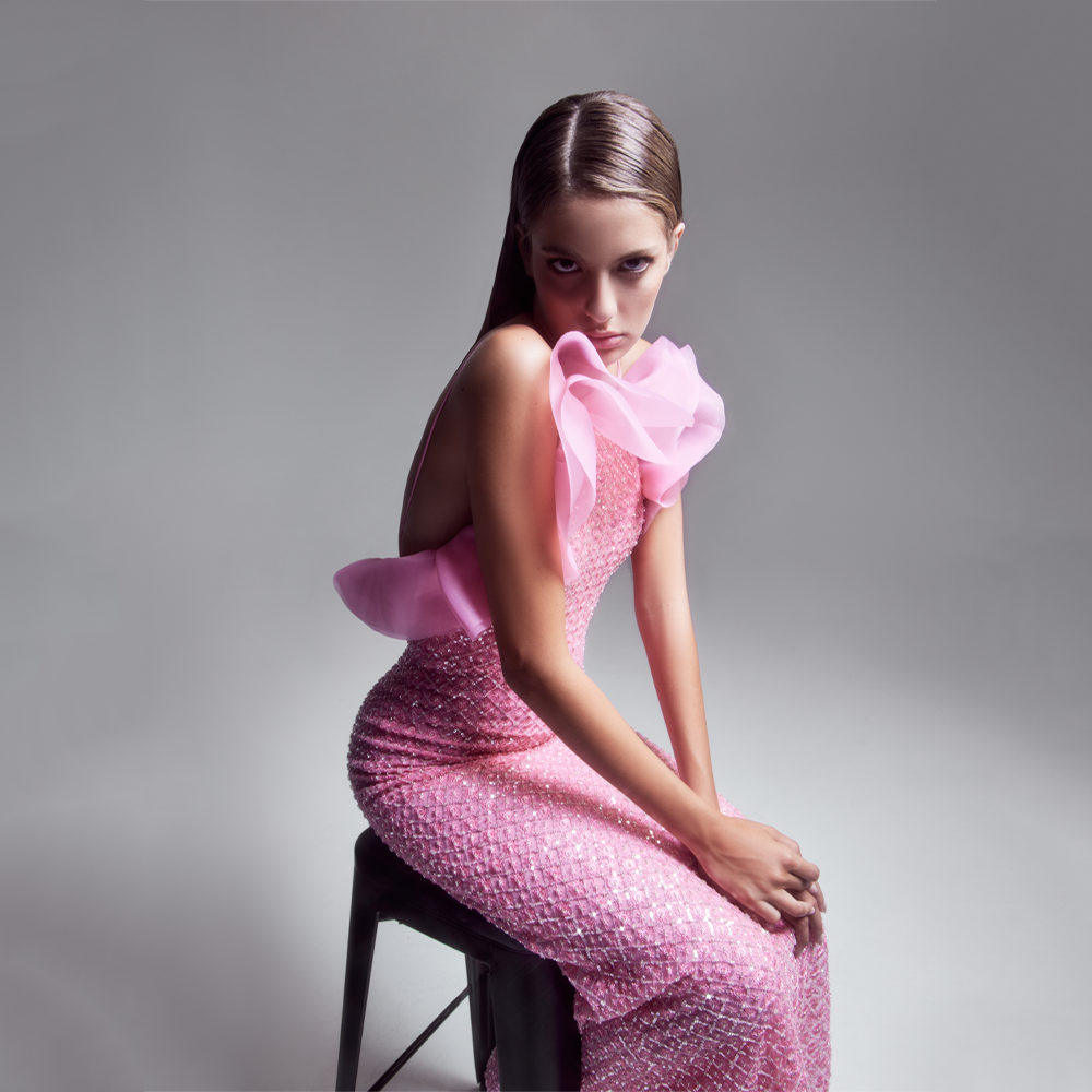 Long fully beaded halter neck “Bubble Gum pink“ sheath dress, open back, with dramatic silk organza fan effect detail on the neckline.