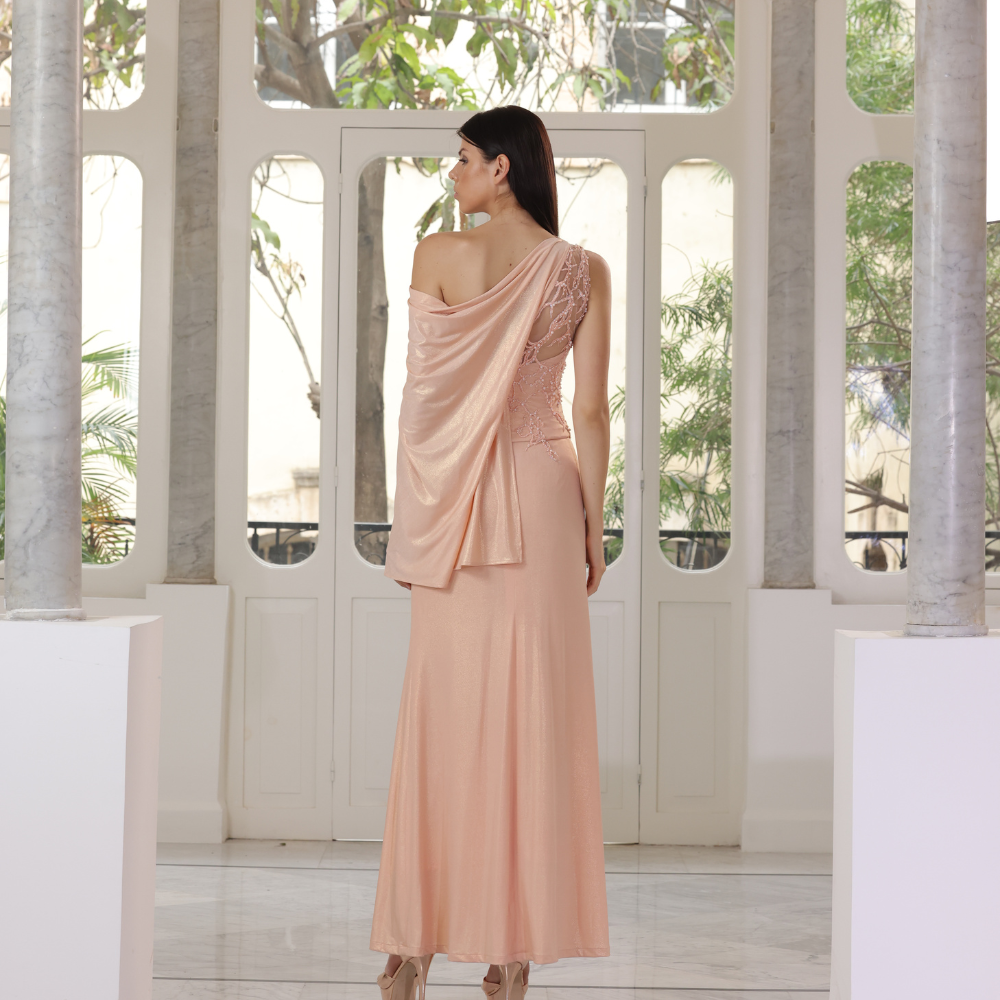Long salmon jersey dress with embroidered bust and one shoulder drape.